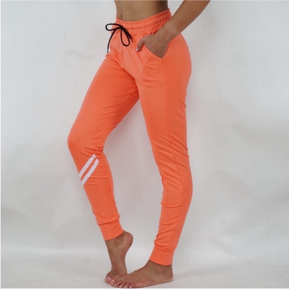 116. Women's Orange Jogger Pants Size Medium
